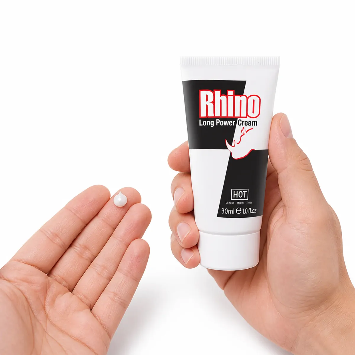 A pea-sized amount of Rhino Long Power Cream on the fingertips of an open hand, with the 30 ml tube held beside it
